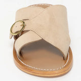 CONI mules en cuir beige clair