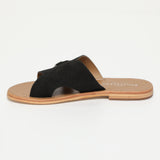 CONI mules en cuir