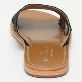 CONI mules en cuir