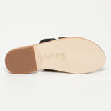 CONI mules en cuir