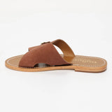 CONI mules en cuir caramel