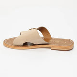 CONI mules en cuir beige clair